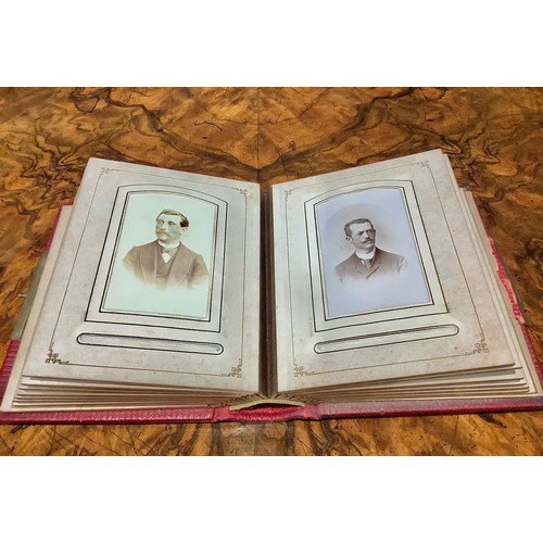 2704 - Photography - a 19th century tooled and gilt red morocco carte de visite album, enclosing a collecti... 