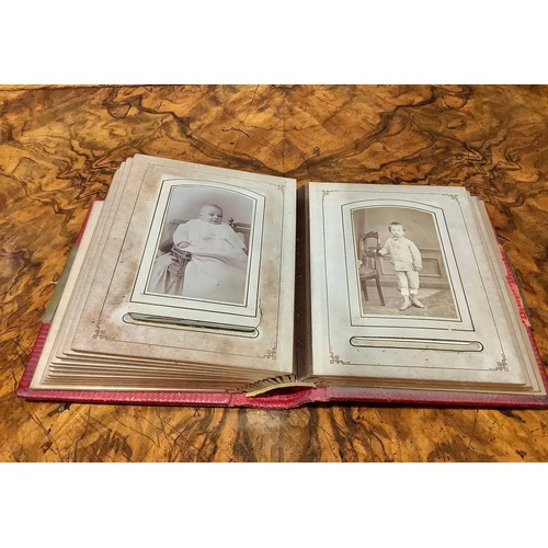 2704 - Photography - a 19th century tooled and gilt red morocco carte de visite album, enclosing a collecti... 