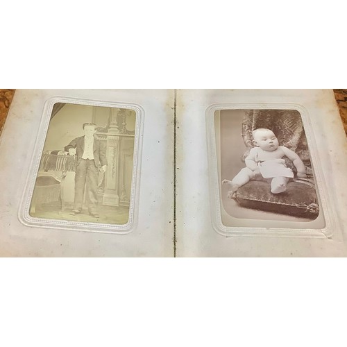 2704 - Photography - a 19th century tooled and gilt red morocco carte de visite album, enclosing a collecti... 