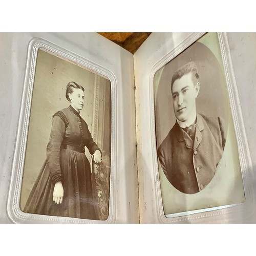 2704 - Photography - a 19th century tooled and gilt red morocco carte de visite album, enclosing a collecti... 