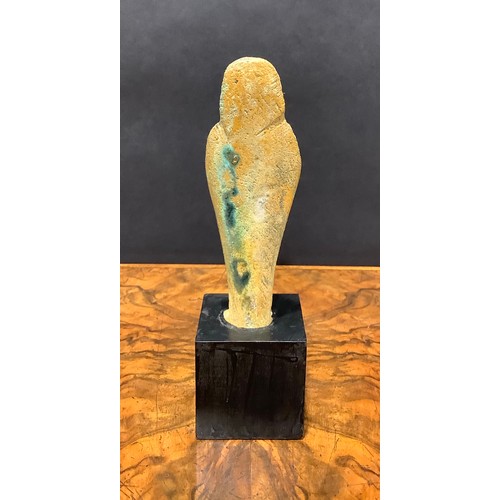 2573 - Antiquities - an Egyptian shabti, traces of turquoise glaze, 15cm high, collector's display plinth