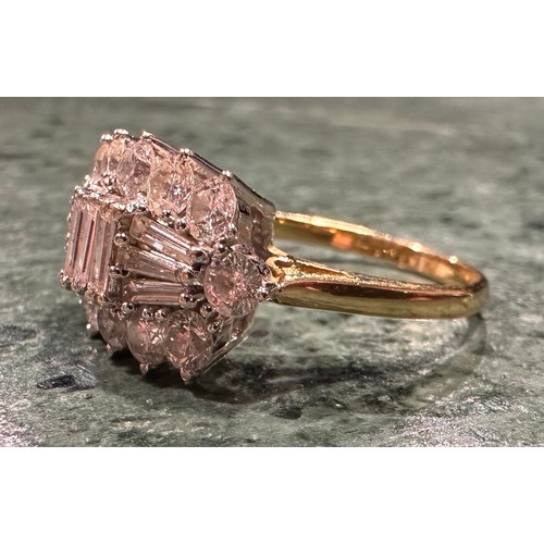 876 - A diamond cluster ring, shaped crest set with nine baguette and twelver round brilliant cut diamonds... 