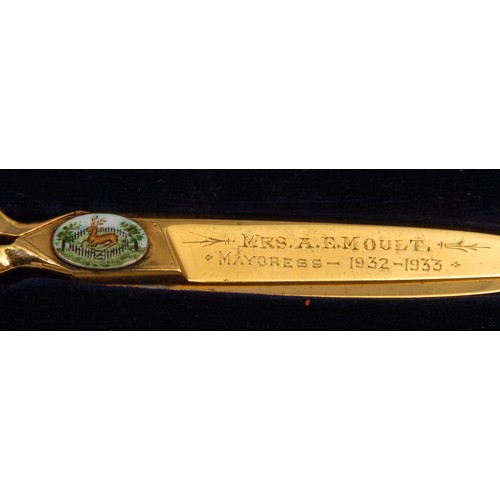 2049 - Local Interest - a pair of inscribed ceremonial gilt scissors, set with an oval enamel cabochon pain... 