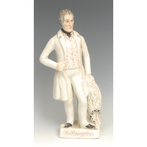 119 - A Staffordshire figure of Wellington, standing by a draped pedestal, gilt titled rectangular base, 3... 