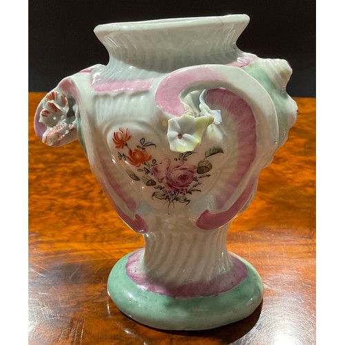 132 - A Longton Hall asymmetric Rococo style pedestal vase, painted with flowers within moulded cartouches... 