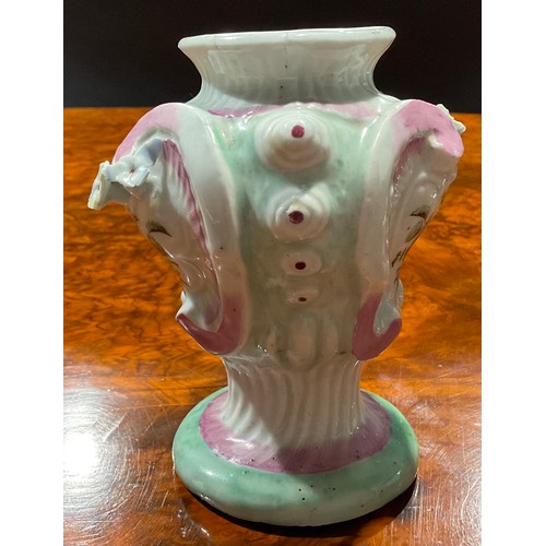 132 - A Longton Hall asymmetric Rococo style pedestal vase, painted with flowers within moulded cartouches... 