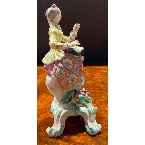 169 - A pair of Bow figures, of musicians, she seated on tree stump wearing yellow jacket and floral dress... 