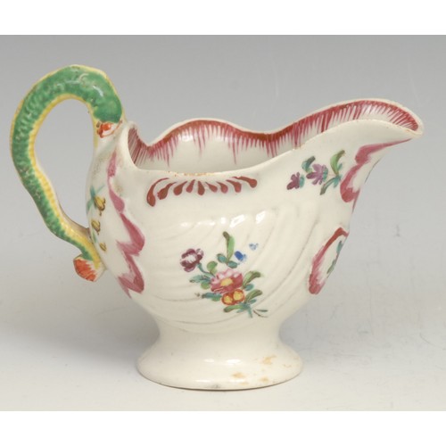 178 - A Liverpool cream boat, moulded with shells and flutes, lamprey moulded handle, painted in coloured ... 