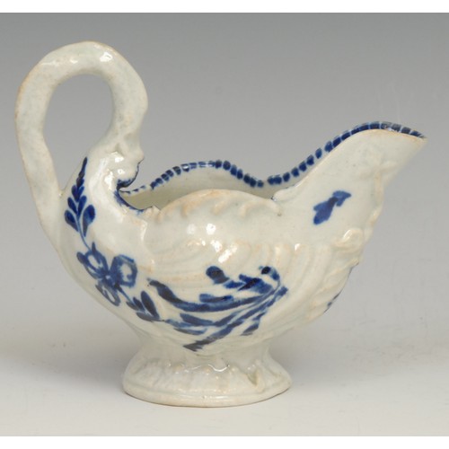 179 - A Liverpool dolphin ewer cream jug, in relief with shell moulding, the spout with entwined dolphins,... 
