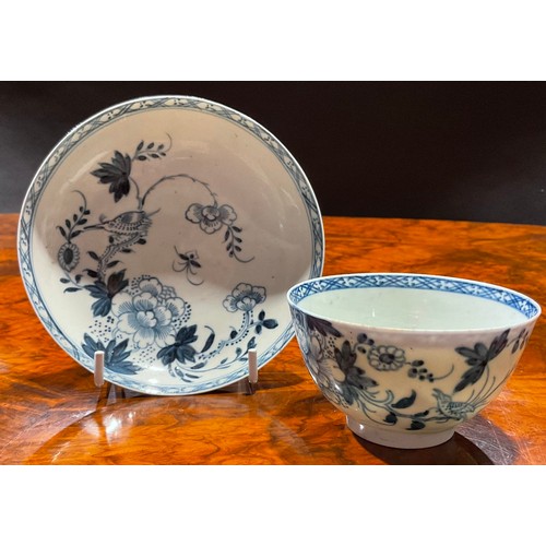 175 - A Chaffers Liverpool Birds in Branches pattern tea bowl and saucer, decorated in underglaze blue, tr... 