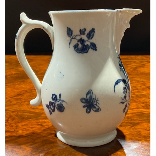 205 - A Worcester Gilliflower pattern jug, decorated in underglaze blue, mask spout, 12.5cm high, crescent... 