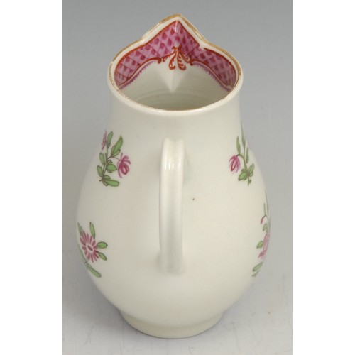 211 - A Worcester sparrow beak jug, decorated in Chinese export style with flowers, the interior with scal... 