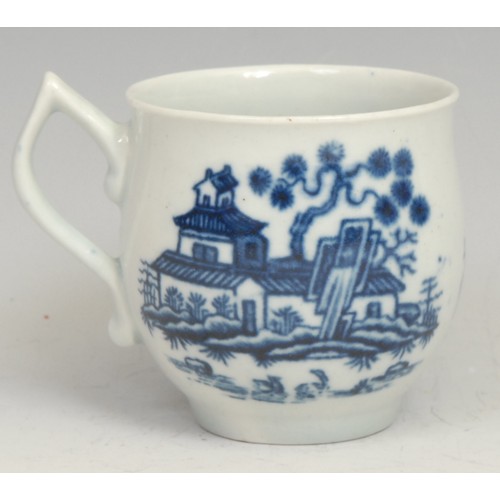 217 - An early Worcester Plantation pattern bell shaped coffee cup, decorated in underglaze blue, tau-shap... 