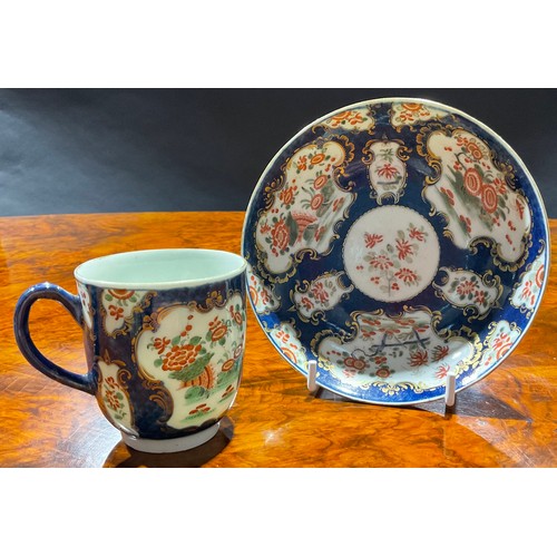 199 - A Worcester coffee cup and saucer, decorated with alternating fan and vase shaped reserves, each wit... 