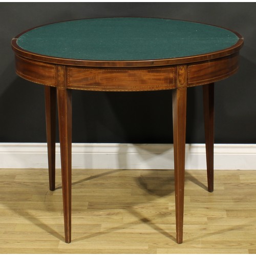 1307 - A George III mahogany demilune card table, hinged top enclosing a baize lined playing surface, taper... 