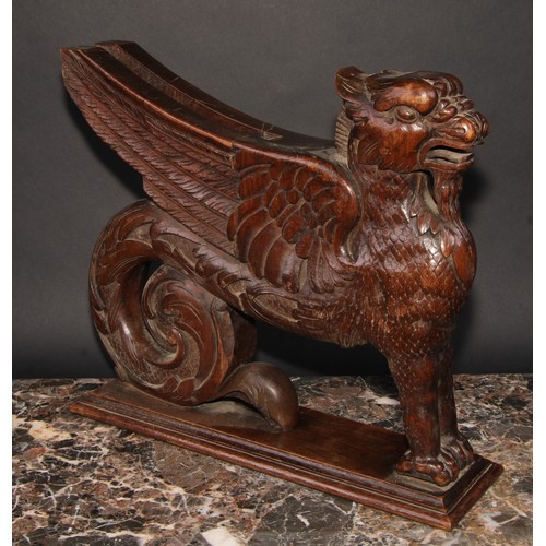 2085 - A pair of 19th century oak sculptural brackets, each carved as a gryphon, 40cm long