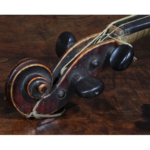 2560 - A violin, the two-piece back 35.5cm long excluding button, ebonised tuning pegs, outlined throughout... 