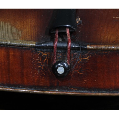 2560 - A violin, the two-piece back 35.5cm long excluding button, ebonised tuning pegs, outlined throughout... 