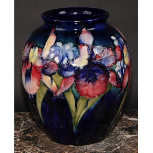 5 - A large Moorcroft Orchid pattern ovoid vase, tube lined with large flowerheads in shades of red, yel... 