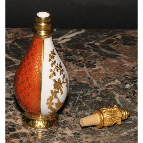 235 - A Lynton porcelain baluster scent bottle, quartered in tangerine, white and gilt with birds amongst ... 