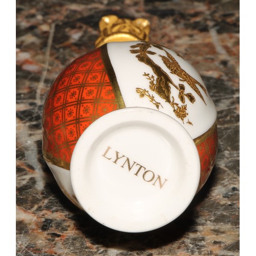 235 - A Lynton porcelain baluster scent bottle, quartered in tangerine, white and gilt with birds amongst ... 