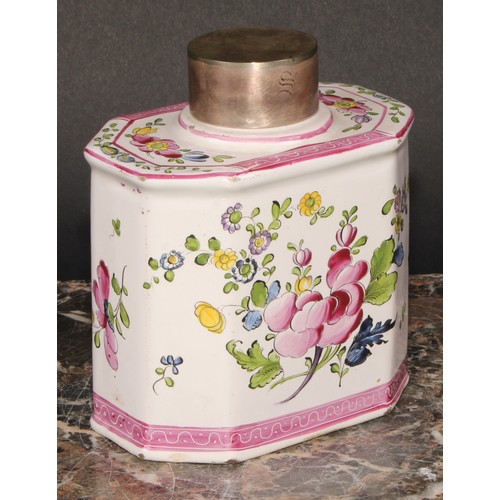 251 - A 19th century Continental faience octagonal tea caddy and cover, painted with stylised flowers, out... 