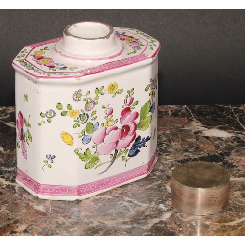 251 - A 19th century Continental faience octagonal tea caddy and cover, painted with stylised flowers, out... 