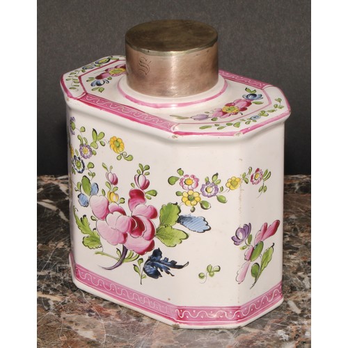 251 - A 19th century Continental faience octagonal tea caddy and cover, painted with stylised flowers, out... 