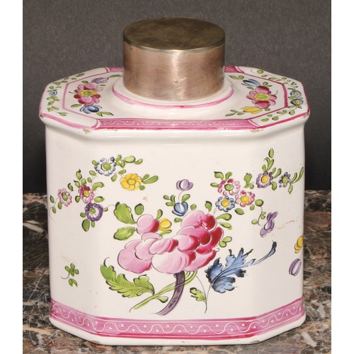 251 - A 19th century Continental faience octagonal tea caddy and cover, painted with stylised flowers, out... 