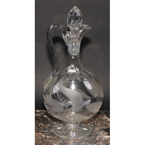 286 - A 19th century ovoid glass decanter and stopper, the scroll feet applied with lion masks, 30cm high;... 