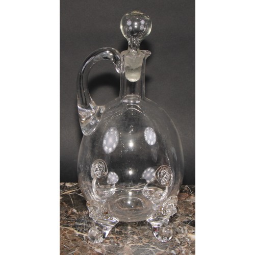 286 - A 19th century ovoid glass decanter and stopper, the scroll feet applied with lion masks, 30cm high;... 