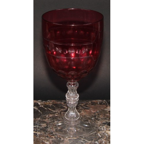 283 - A 19th century cranberry glass oversized wine goblet, star-cut base, 23.5cm high, dated May 18th 186... 