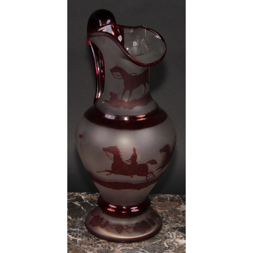 282 - A 19th century bohemian glass ewer, decorated with scenes of horse racing, 30cm high, c.1880