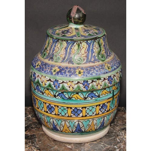 351 - A pair of 19th century Moroccan earthenware Jobbana or cheese/butter jar and cover, decorated in pol... 