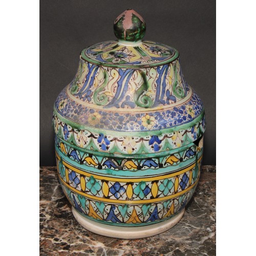 351 - A pair of 19th century Moroccan earthenware Jobbana or cheese/butter jar and cover, decorated in pol... 