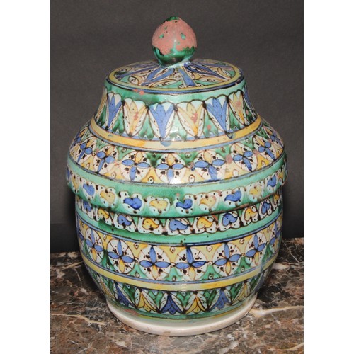 351 - A pair of 19th century Moroccan earthenware Jobbana or cheese/butter jar and cover, decorated in pol... 