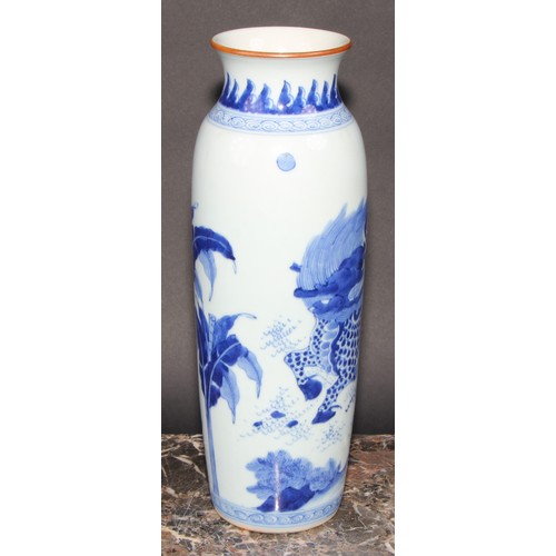 446 - A Chinese rolwagen sleeve vase, painted with a kylin and banana plants, 30cm high