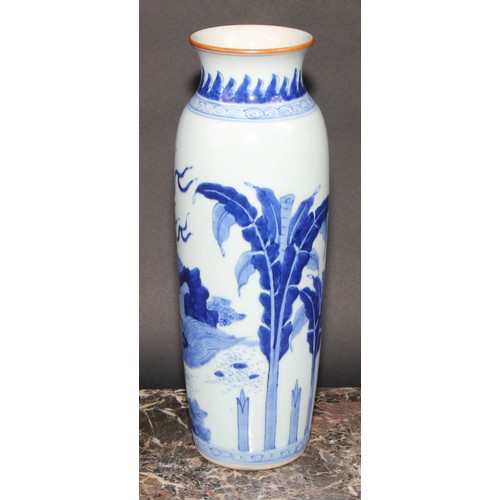 446 - A Chinese rolwagen sleeve vase, painted with a kylin and banana plants, 30cm high