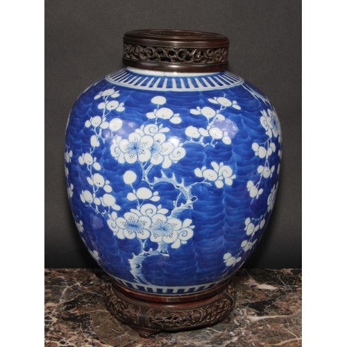 342 - A large Chinese ovoid ginger jar, painted in tones of underglaze blue with blossoming prunus on a gr... 