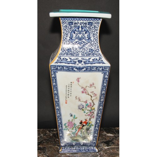 343 - A large Chinese tapered square vase, decorated in polychrome enamels with panels of fanciful birds a... 