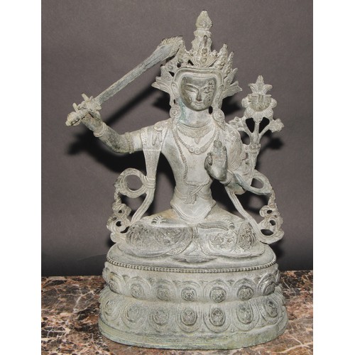 459 - Chinese School, a verdigris patinated bronze, Tara, lotus base, 38cm high