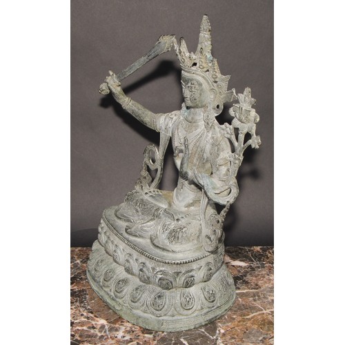 459 - Chinese School, a verdigris patinated bronze, Tara, lotus base, 38cm high