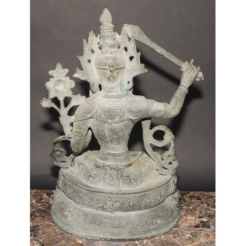 459 - Chinese School, a verdigris patinated bronze, Tara, lotus base, 38cm high