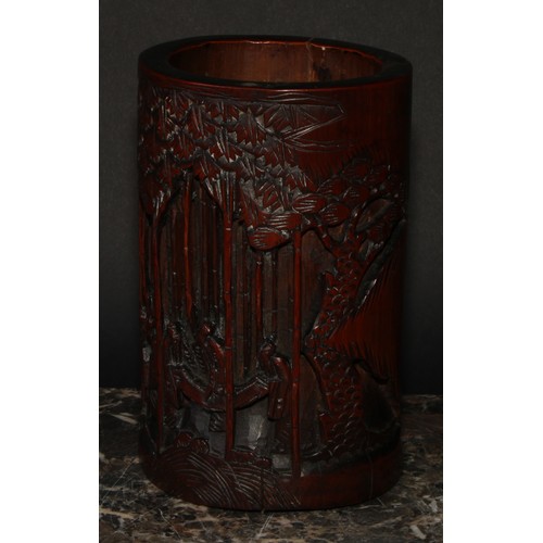 372 - A pair of Chinese bamboo bitong brush pots, carved with figures amongst trees, 18.5cm high, early 20... 