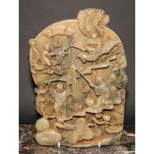 364 - A Chinese soapstone tablet or screen, profusely carved with figures, mythical beasts and auspicious ... 