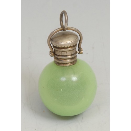 1234 - An early 20th century silver coloured metal mounted celadon jade glass globular chatelaine scent bot... 