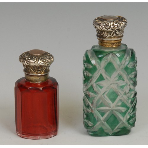 1215 - A 19th century silver coloured metal mounted green-cased glass scent bottle, 7cm long, c.1860; anoth... 