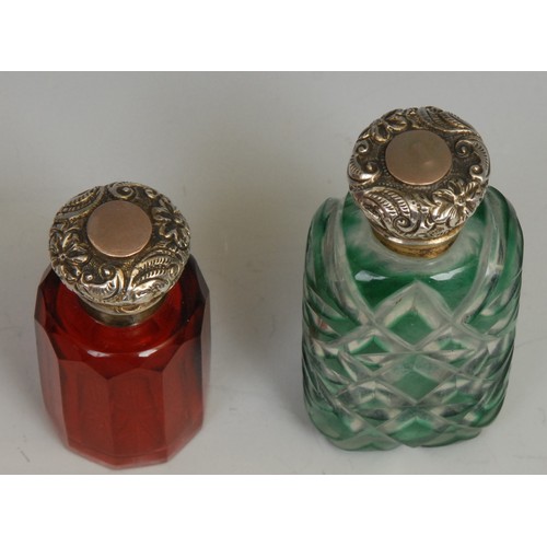 1215 - A 19th century silver coloured metal mounted green-cased glass scent bottle, 7cm long, c.1860; anoth... 