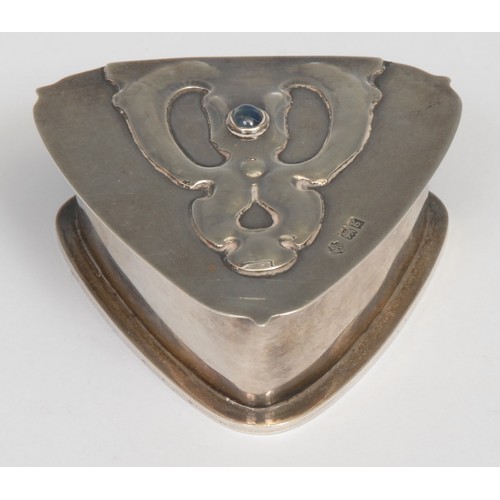 751 - An Art Nouveau silver triform box, hinged cover chased with a stylised organic motif, set with a blu... 