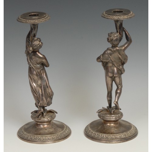 675 - A pair of sculptural Victorian silver figural candlesticks, cast as a Bacchic reveller and  maenad r... 